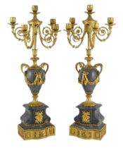 A pair of Louis XVI style ormolu and grey marble five light candelabra with scrolling branches and
