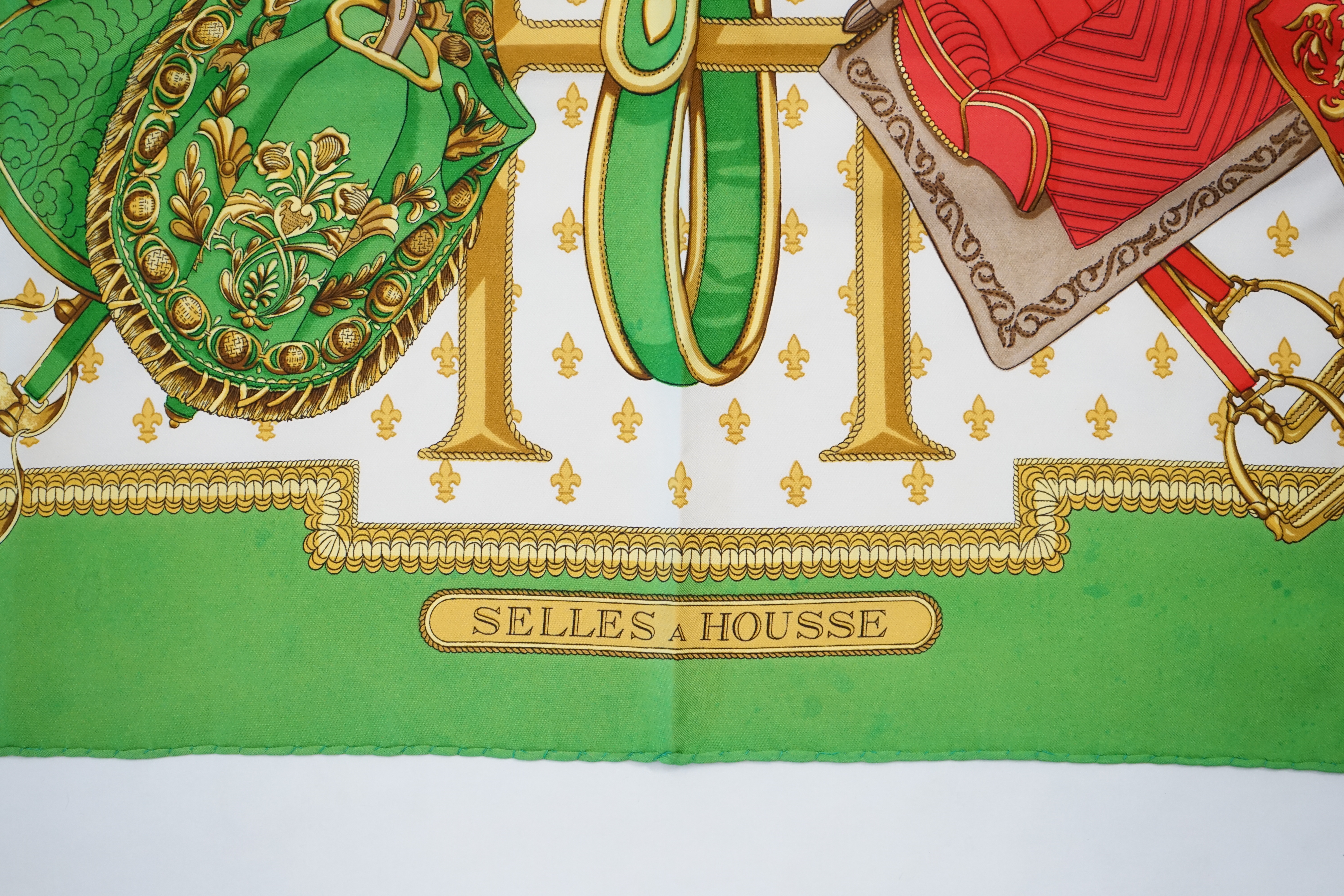 A Hermès silk Scarf "Selles a Housse" by Christiane Vauzelles, green/red/white/gold, with box, - Image 6 of 6