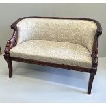 A small Regency style mahogany settee, the reeded frame with swans heads end scrolls, width 125cm,