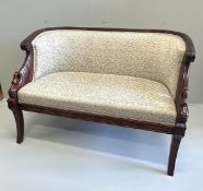 A small Regency style mahogany settee, the reeded frame with swans heads end scrolls, width 125cm,