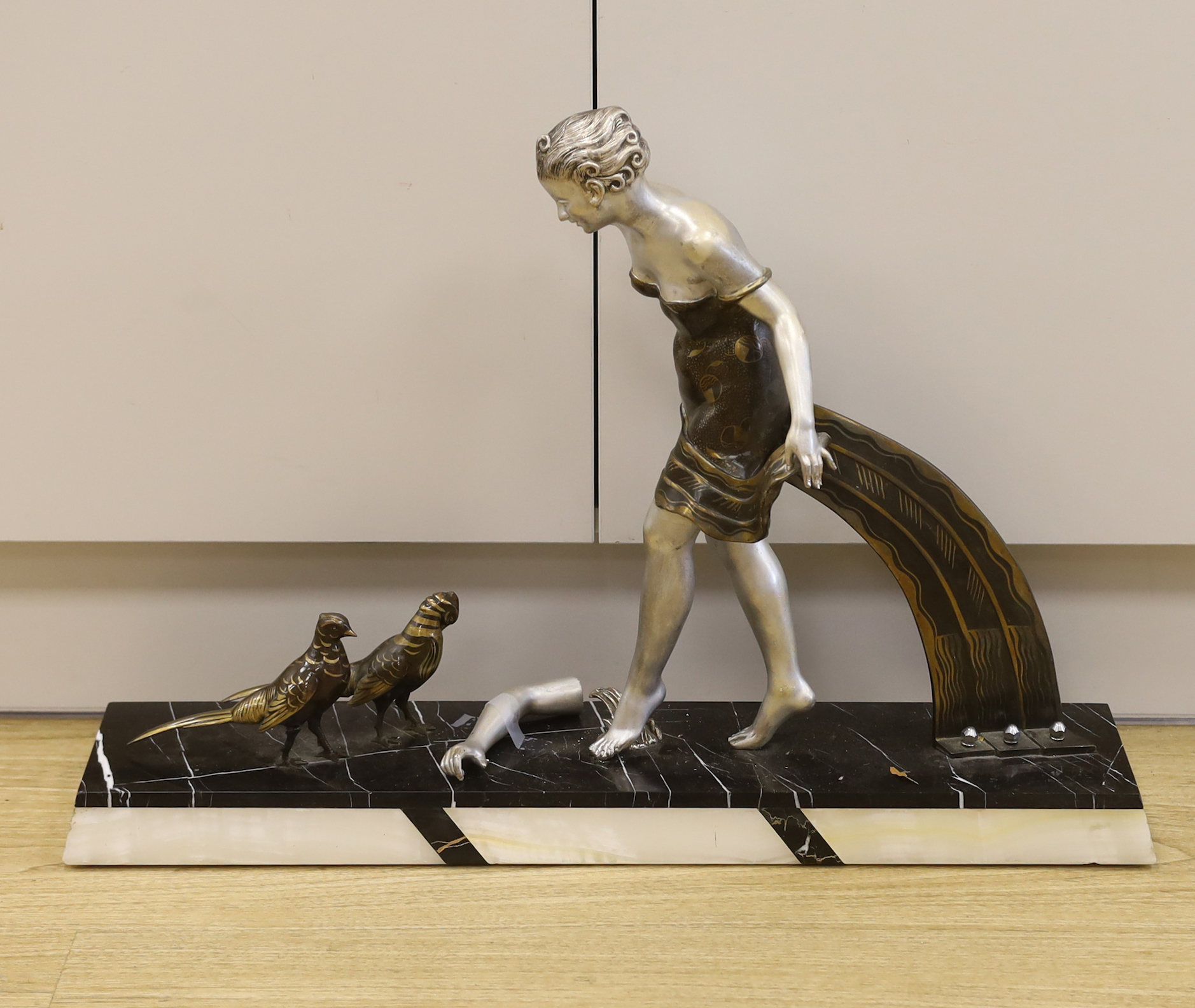 A French Art Deco spelter and marble figure group, 49cm tall (a.f.)***CONDITION REPORT***PLEASE