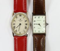 A 14k white metal Jules Jurgensen oval manual wind dress wrist watch, on an associated red leather