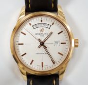 A gentleman's 2013 18ct gold Breitling Transocean automatic day/date wrist watch, with baton