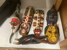 Six Indonesian tribal painted wood masks, largest 60cm high***CONDITION REPORT***PLEASE NOTE:-