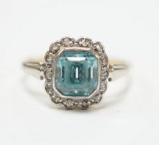 An 18ct and plat, blue zircon and diamond chip cluster set ring, size O, gross weight 3.4 grams.***