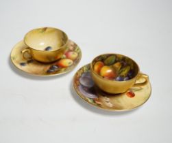A pair of Royal Worcester fruit painted miniature cabinet cups and saucers, signed F. Harper and W.