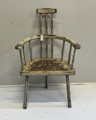 An 18th century style painted hardwood primitive elbow chair, width 68cm, depth 44cm, height