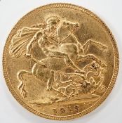 A George V 1915 gold sovereign.***CONDITION REPORT***PLEASE NOTE:- Prospective buyers are strongly
