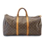 A Louis Vuitton Speedy 40 bag in brown monogram canvas and natural leather, width 22cm, length 51cm,