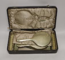 A cased 1930's six piece plated mirror and brush set.***CONDITION REPORT***PLEASE NOTE:- Prospective