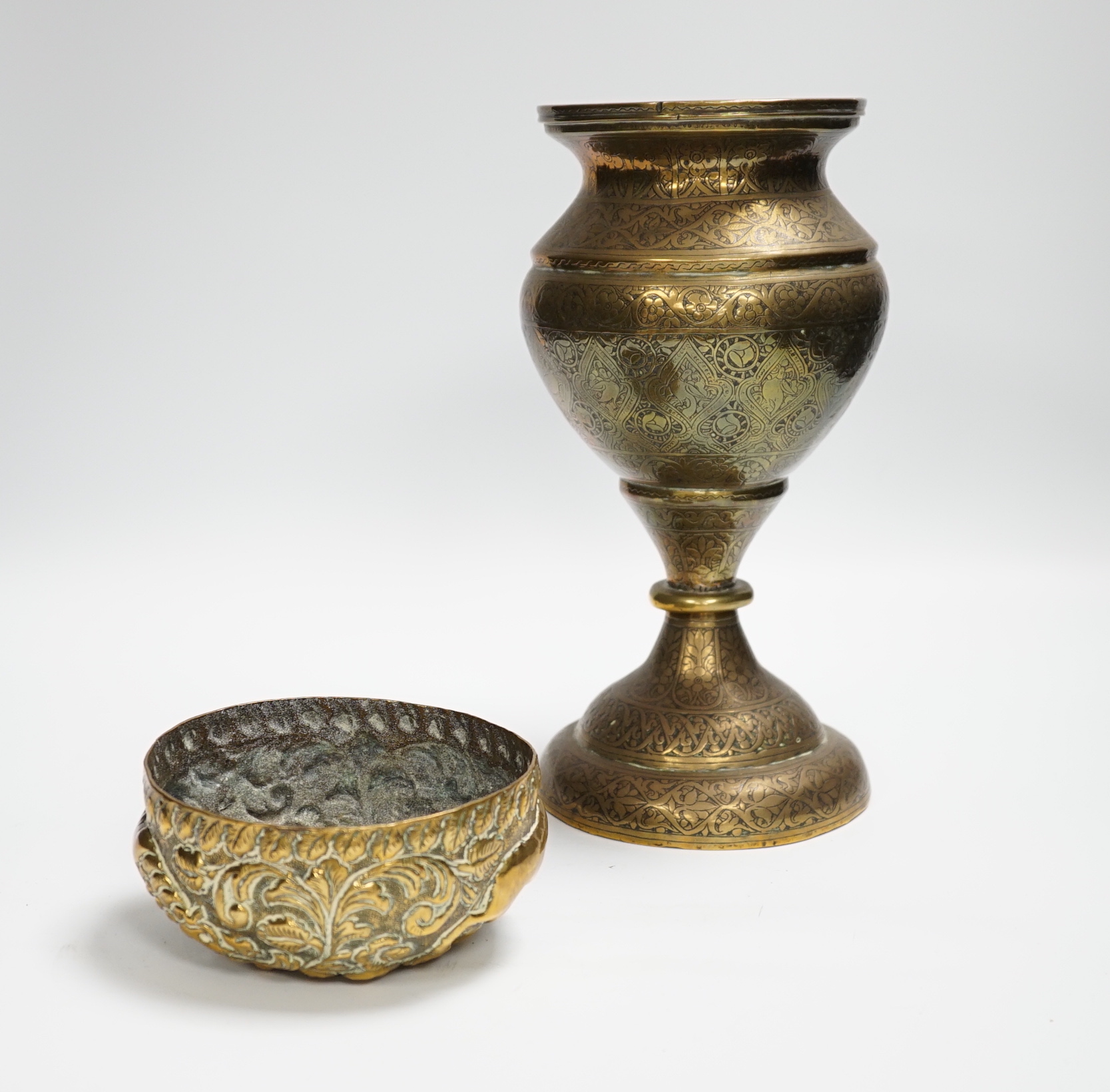 A Persian Qajar engraved brass vase and an Indian repousse brass bowl, largest 25cm high***CONDITION