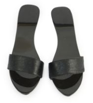 A pair of Hermès black pony skin and lacquer mules, Size 39***CONDITION REPORT***A few small chips