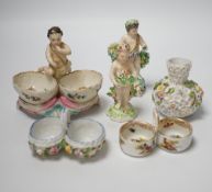 A group of German flower encrusted tableware, including a matched Meissen cup and saucer, lidded