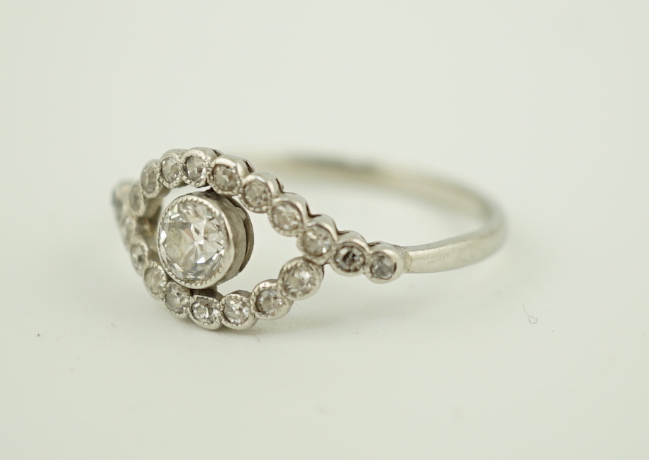 A white metal and single stone elliptical shaped ring, with diamond set border and shoulders, size - Image 3 of 5