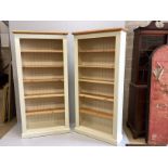 A pair of modern cream painted tall pine open bookcases with adjustable shelves, width 96cm, depth