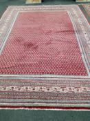 A North West Persian red ground carpet, 366 x 272cm***CONDITION REPORT***PLEASE NOTE:- Prospective