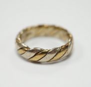 A two colour 9ct gold band size N, 6.3 grams.***CONDITION REPORT***PLEASE NOTE:- Prospective