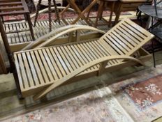 A pair of stained hardwood garden loungers, length 198cm, depth 82cm***CONDITION REPORT***PLEASE