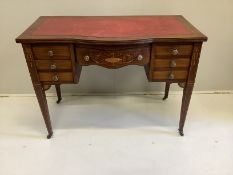 An Edwardian inlaid mahogany bowfront kneehole writing table, width 99cm, depth 52cm, height