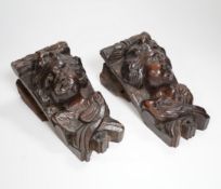 A pair of Italian carved walnut putti corbels, 18cm high***CONDITION REPORT***PLEASE NOTE:-