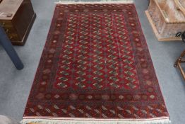 A Bokhara carpet, 290 x 202cm***CONDITION REPORT***PLEASE NOTE:- Prospective buyers are strongly