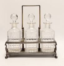 A silver plated three decanter tantalus***CONDITION REPORT***PLEASE NOTE:- Prospective buyers are
