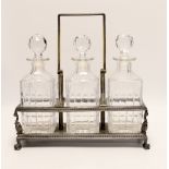 A silver plated three decanter tantalus***CONDITION REPORT***PLEASE NOTE:- Prospective buyers are