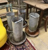 Four vintage galvanised poultry feeders, largest height 62cm***CONDITION REPORT***PLEASE NOTE:-