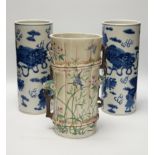 A pair of Chinese blue and white cylindrical hat stands, 29cm high and a Japanese porcelain vase