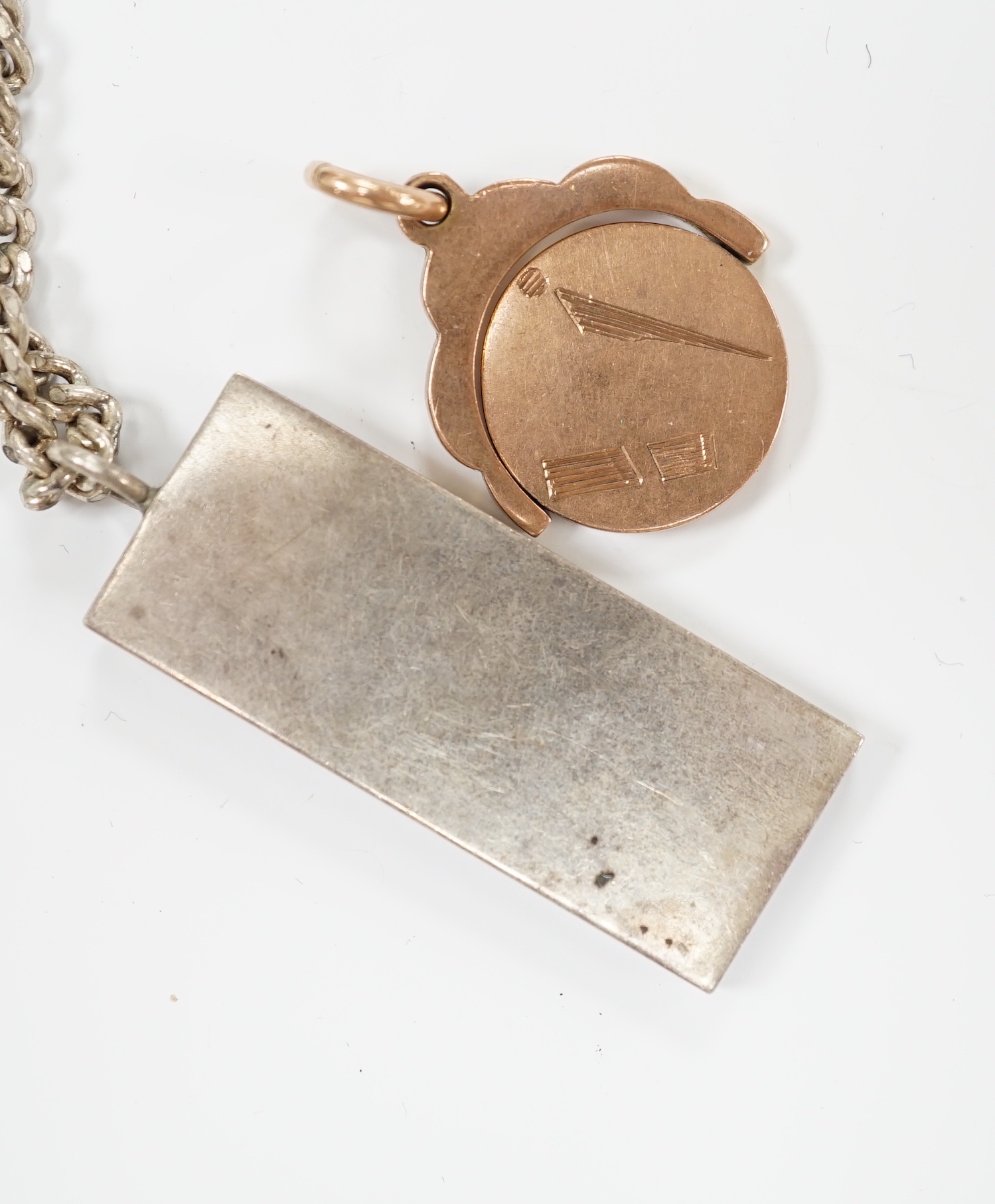 A 9ct gold swivelling masonic pendant, 12.3 grams and a silver ingot pendant, on a 925 chain.*** - Image 2 of 2