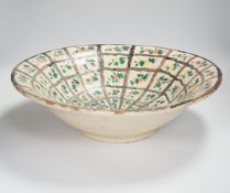 A large Persian glazed pottery bowl, 39cm diameter***CONDITION REPORT***PLEASE NOTE:- Prospective