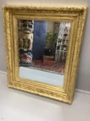 A Victorian giltwood and composition 'picture frame’, now as a wall mirror, width 82cm, height