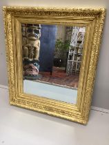 A Victorian giltwood and composition 'picture frame’, now as a wall mirror, width 82cm, height