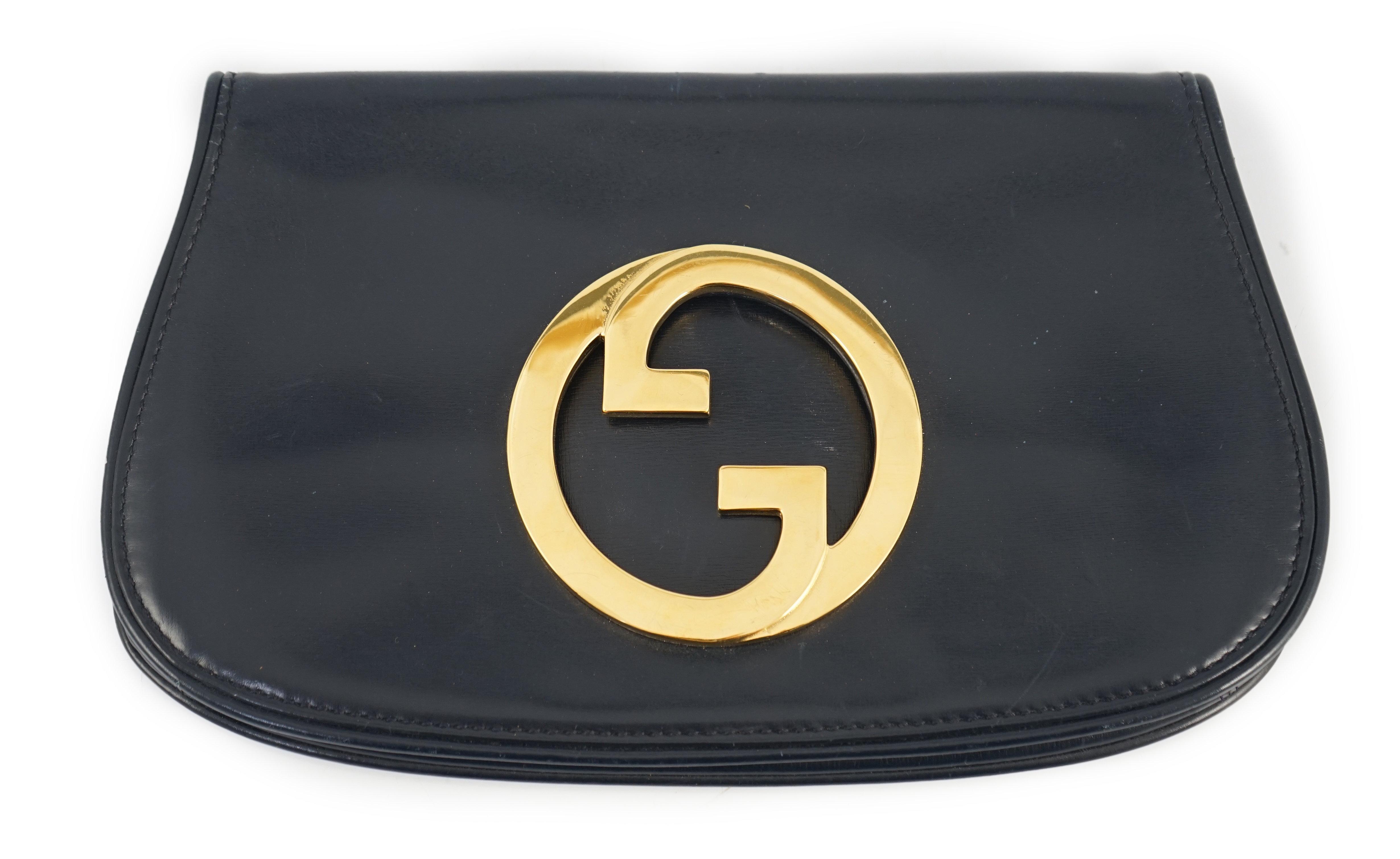 A vintage Gucci Blondie Unicorn navy leather clutch bag, Gold Gucci front logo, weighted closure,