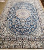 A Nain blue ground carpet, 285 x 205cm***CONDITION REPORT***PLEASE NOTE:- Prospective buyers are