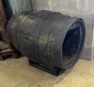 A vintage coopered wine barrel on stand, now converted to a dog's kennel, width 96cm, height