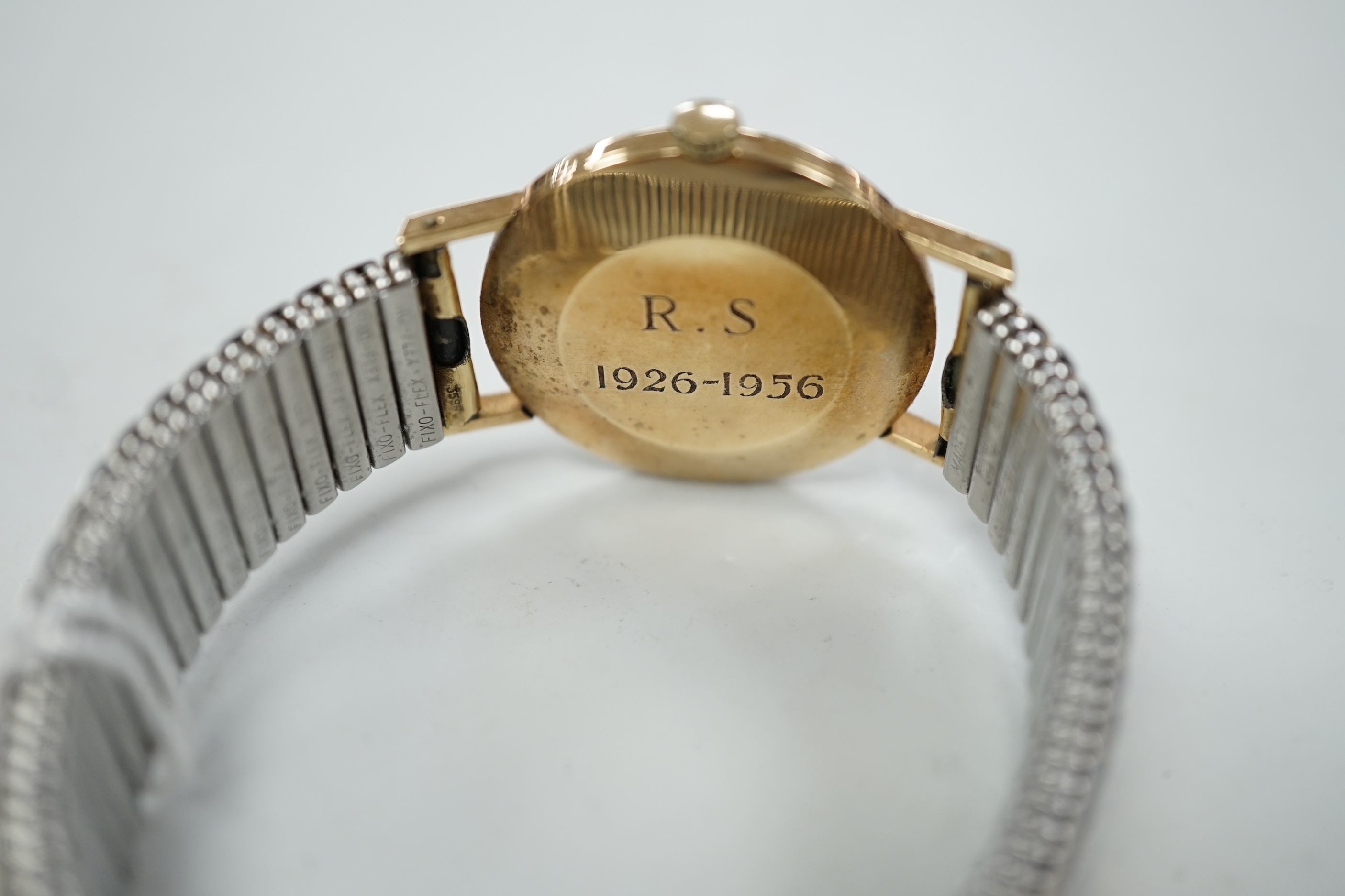 A gentleman's 9ct. gold Longines manual wind wrist watch, with engraved inscription, on an - Image 4 of 4