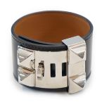 An Hermès Collier De Chien bracelet in black calf leather with an adjustable closure and palladium-