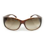 A pair of Prada tortoiseshell sunglasses with hard case***CONDITION REPORT***A little dirty but