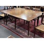 A George III mahogany drop leaf extending dining table on square tapered legs, 165cm extended, depth