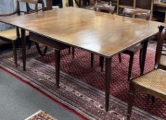 A George III mahogany drop leaf extending dining table on square tapered legs, 165cm extended, depth