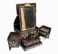 A Chinese mother-of- pearl inlaid hongmu vanity cabinet, late Qing dynasty, with fitted interior