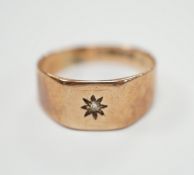A 9ct gold and diamond chip set signet ring, size R, gross weight 3.7 grams.***CONDITION REPORT***