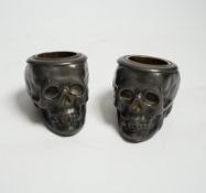 A pair of late 19th century skull shaped pewter match holders, 5cm tall***CONDITION REPORT***