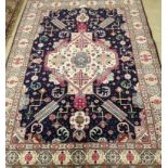 A Tabriz blue ground rug, 200 x 140cm***CONDITION REPORT***PLEASE NOTE:- Prospective buyers are