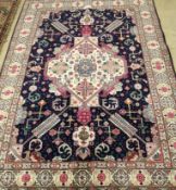 A Tabriz blue ground rug, 200 x 140cm***CONDITION REPORT***PLEASE NOTE:- Prospective buyers are