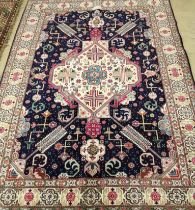 A Tabriz blue ground rug, 200 x 140cm***CONDITION REPORT***PLEASE NOTE:- Prospective buyers are