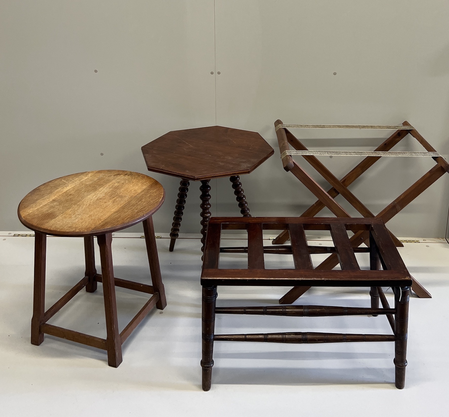 A late Victorian mahogany luggage rack, an octagonal occasional table, a circular oak table,