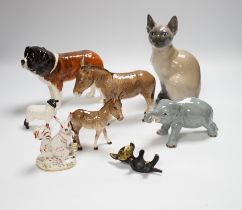 Eight animals including four Beswick, a Szeiler, a Royal Copenhagen, a cast metal cat and a