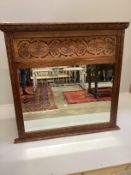 A late 19th century carved oak overmantel mirror, width 112cm, height 112cm***CONDITION REPORT***